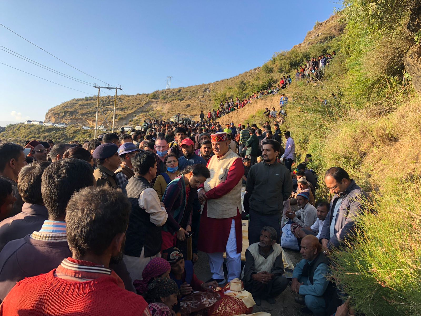 Cabinet Minister Ganesh Joshi consoles the families of the casualties of the accident in Byla village of Chakrata.