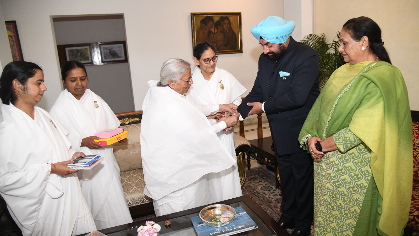 Brahma Kumaris family wear Rakhi to Governor