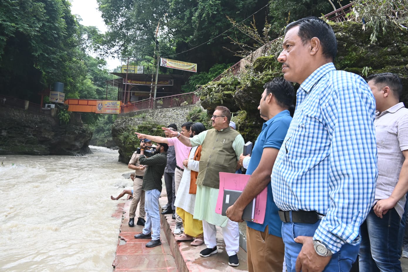 Minister Ganesh Joshi inspecting the damage caused due to rains in Tapkeshwar temple area and Bhitarli village.