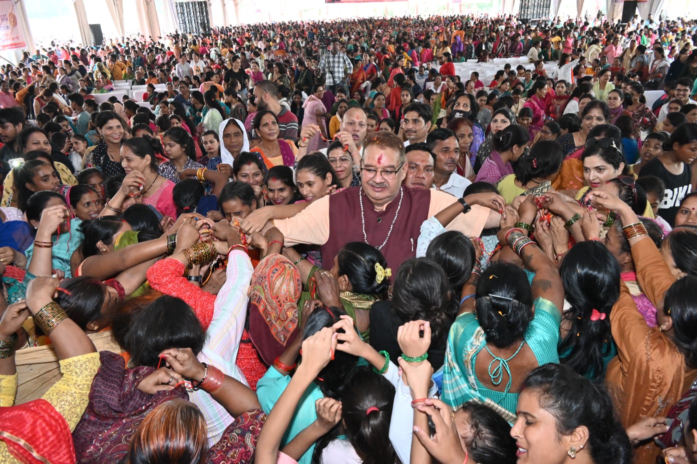More than 15,000 sisters tied raksha sutra on the wrist of minister Ganesh Joshi during Raksha Bandhan celebrations 2023.