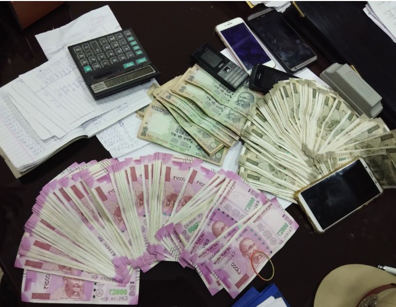 Bookie caught with thousands of cash