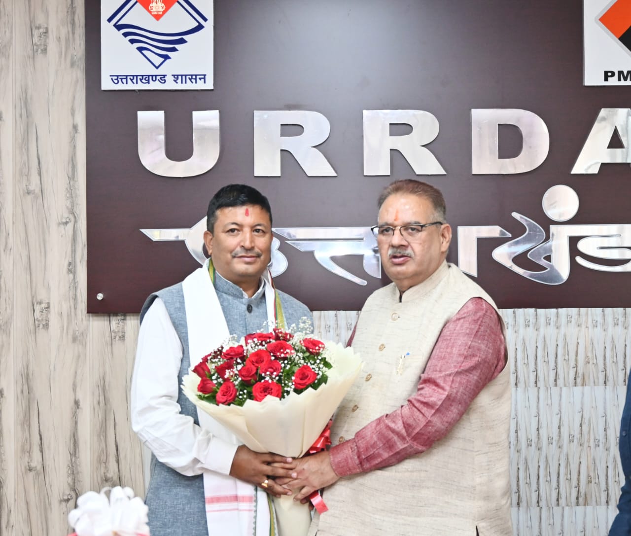 Minister Joshi congratulated newly appointed responsible Shiv Singh Bisht on assuming charge.