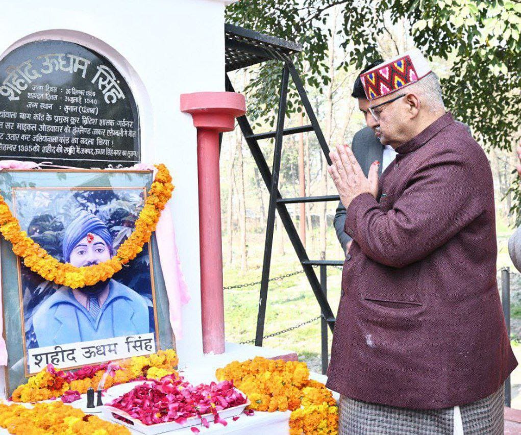 Minister Ganesh Joshi paying homage to the portrait of Martyr Sardar Udham Singh installed in Rudrapur District Office premises on the birth anniversary of Martyr Udham Singh.